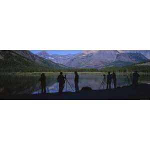 Photographers Standing at a Lakeside, US Glacier National Park 