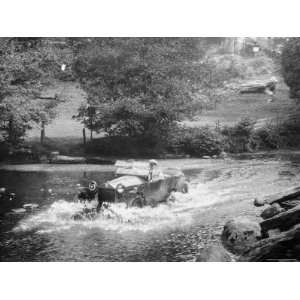  1925 Lancia Lambda Driving Through a Shallow River 