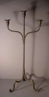   forged, very tall, three pronged iron candle holder, signed MP