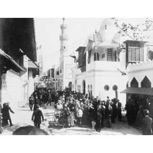 1889 photo Crowd on a street in Cairo in front of the Pavilions of 