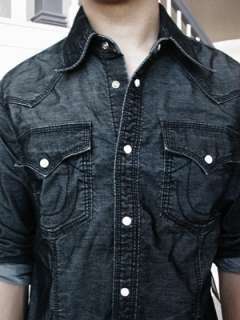   shirt in black. Corduroy fabric with pearl buttons. 100% cotton