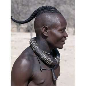  Himba Youth Has His Hair Styled in a Long Plait, known as 