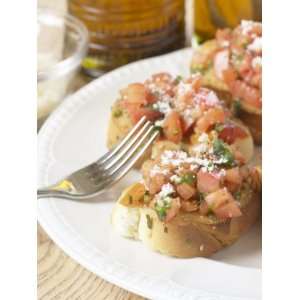  Fork Beside Plate of Fresh and Delicious Bruschetta 