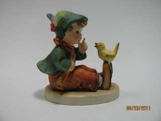 Goebel Hummel figurine Boy sitting with yellow bird on shoe with flute 