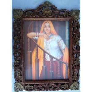Elegant Indian Traditional Lady standing in her home wood craft hand 