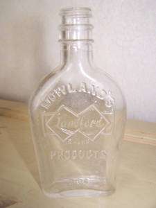 old Nowlands Products Landford Brand 2 oz glass bottle  