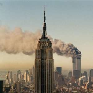 Twin Towers of the World Trade Center Burn Behind the Empire 