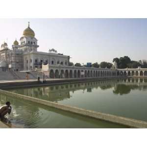 Sikh Pilgrim Bathing in the Pool of the Gurudwara Bangla Sahib Temple 