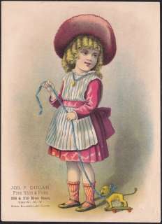 WELL DRESSED GIRL WITH HER DOG PULL TOY ADVERTISING FOR JOS. P. DUGAN 