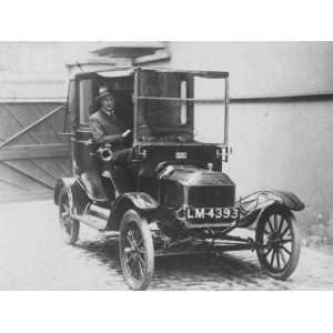  Driver Behind Wheel of a 1912 Ford Model T Taxi Stretched 