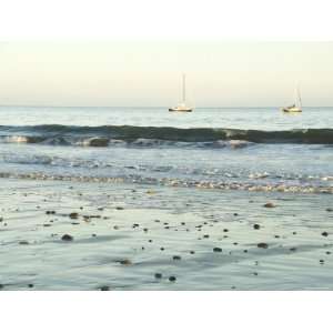  Pebbles in Wet Sand with Small Waves and Sail Boats in the 